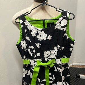 K black sleeveless dress with white flowers and green ribbon size 10